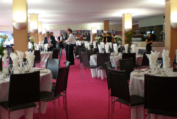 Interior of restaurant with laid round tables